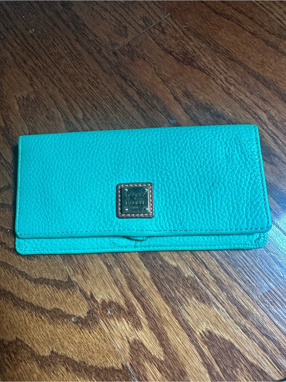 Dooney & Bourke Lucca Flap Wallet features textured pebble grain leather